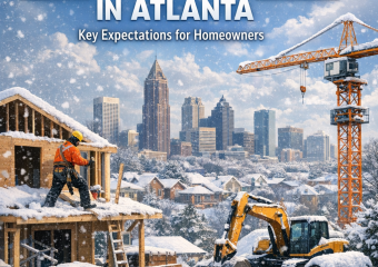 Active winter construction site in snowy Atlanta with cranes and workers.